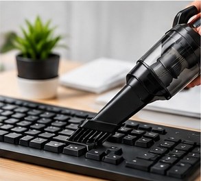 Brush attachment cleaning dust from a computer keyboard