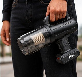 Person carrying the MAX vacuum by its handle